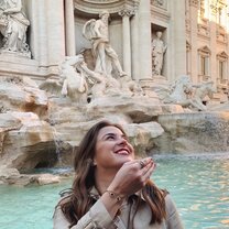 Participant throws a coin into the Trevi Fountain